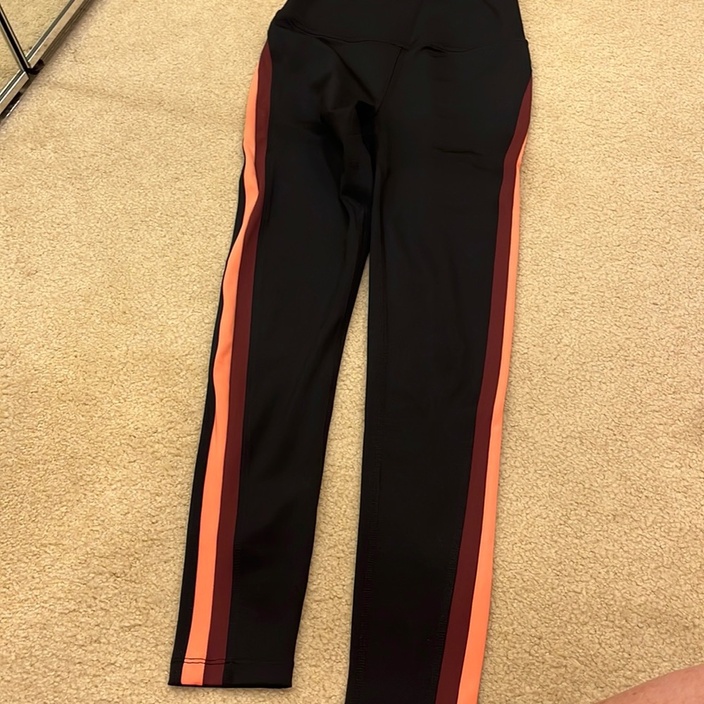 Split 59 leggings black with maroon and peach piping on side. Worn once